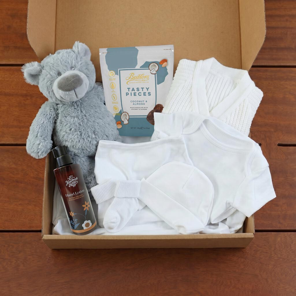 Welcome Home Mum and Baby neutral gift box with white baby clothing set, teddy bear, chocolates and hand lotion