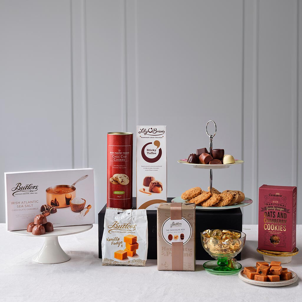 Sweet Irish Gift Box featuring Butlers chocolates, vanilla fudge, chocolate and ginger cookies, whiskey truffles, and assorted festive treats – available at GiftsDirect.com