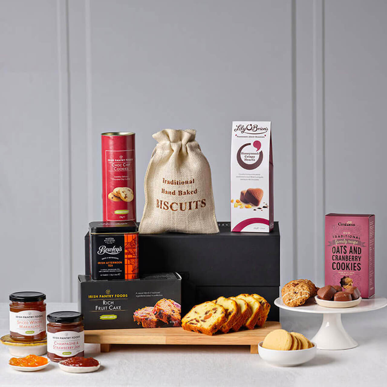 Ultimate Irish Afternoon Tea Hamper featuring traditional Irish treats including biscuits, chocolates, preserves, fruit cake, and cookies.